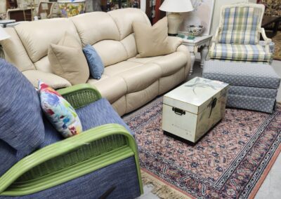 Living room furniture with various seating arrangements.