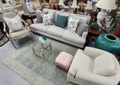Living room furniture set with decorative pillows.