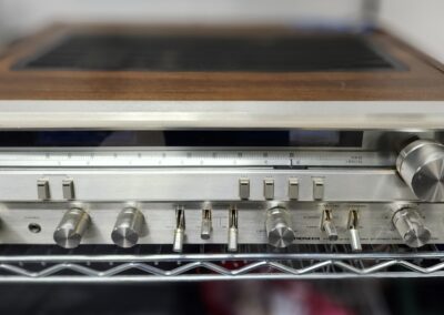 Vintage stereo receiver with wooden casing.