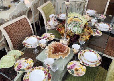 Elegant dining table with floral dinnerware set.