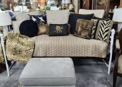 Sofa with animal-themed decorative pillows.