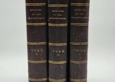 Three vintage leather-bound books in French.