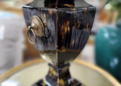 Ornate black and gold decorative lamp base.