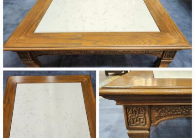 Wooden coffee table with carved legs.
