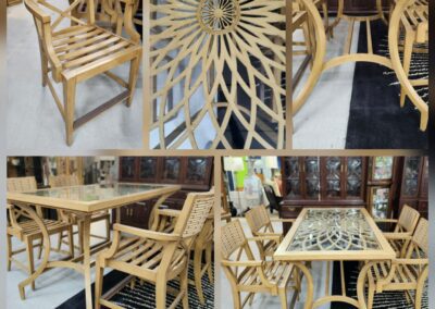 Wooden furniture set with intricate table design.