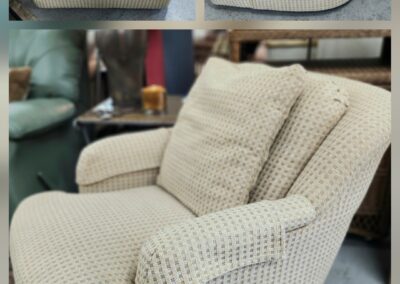 Beige upholstered armchair in three views.