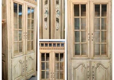 Antique wooden cabinet with glass doors.