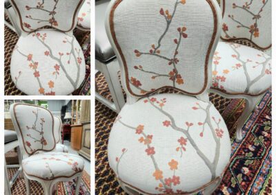 Floral-patterned chair on decorative rug.