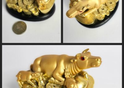 Golden cow figurine with coins.