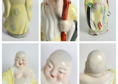 Ceramic statues of elderly and smiling figures.