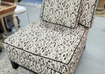 Patterned chair with cushion in a furniture store.