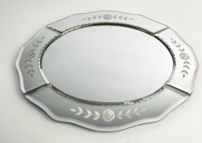 Oval mirror tray with floral engravings.