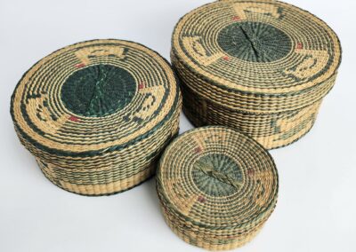 Three woven baskets with decorative patterns.
