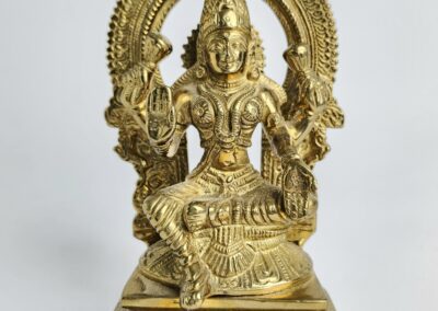 Golden deity statue with intricate details.