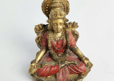 Golden deity statue with red robe.