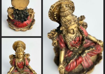 Golden deity statue with intricate detailing.