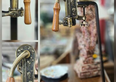 Vintage metal corkscrew with wooden handle.