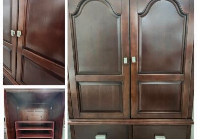 Wooden armoire with shelves and drawers.