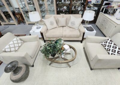 Living room setup with beige furniture.