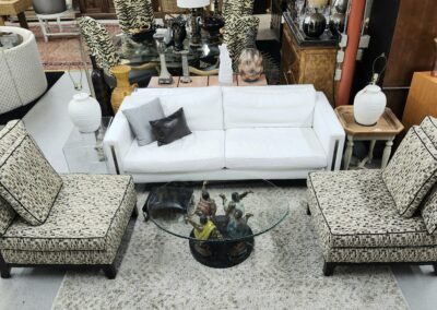 Living room furniture with patterned chairs.