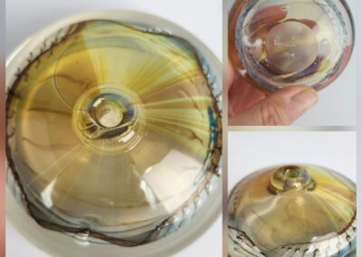 Glass paperweight with swirled multicolor design.