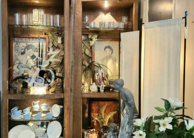 Decorative room with shelves and statue fountain.