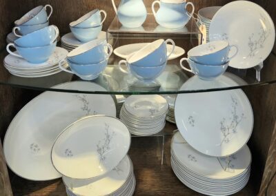Blue and white porcelain tea set display.