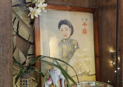 Decorative shelf with Asian art and ornaments.