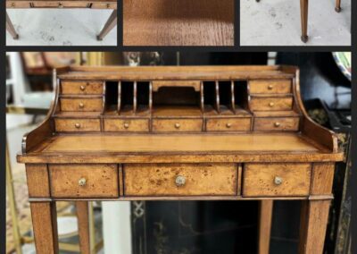 Wooden secretary desk with multiple compartments.