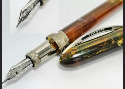 Colorful fountain pen with detailed nib close-up.