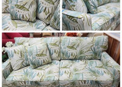 Floral-patterned sofa with matching cushions.