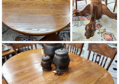 Wooden dining table and chairs with decorations.