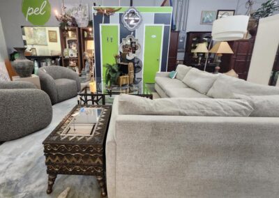 Furniture showroom with sofas and decorative items.