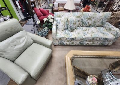 Furniture set with chair and floral sofa.