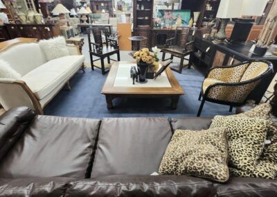 Furniture showroom with various chairs and sofas.