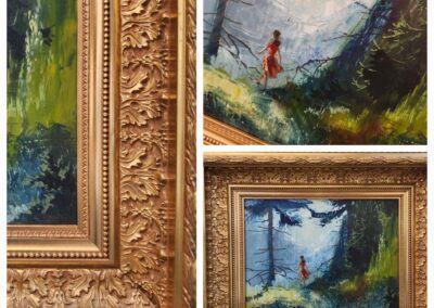 Framed landscape painting with woman in red.