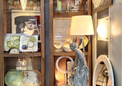 Decorative shelves with art and lighting fixtures.