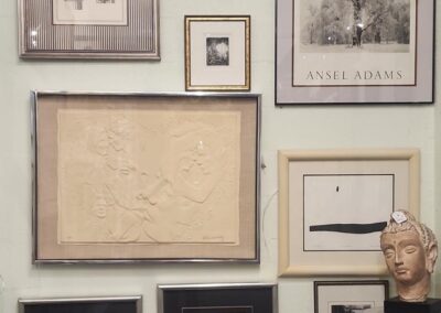 Art and photo collage on display wall.