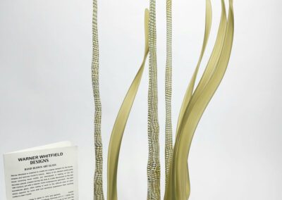 Modern abstract sculpture with a descriptive plaque.