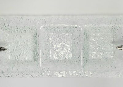 Glass tray with decorative lizard handles.