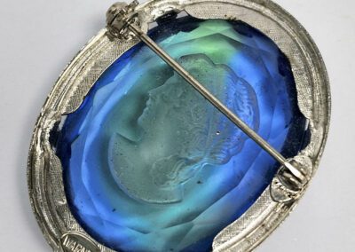 Oval blue cameo brooch with portrait engraving.
