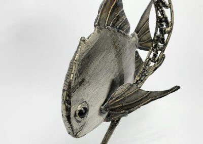Metal fish sculpture with curved arch design.