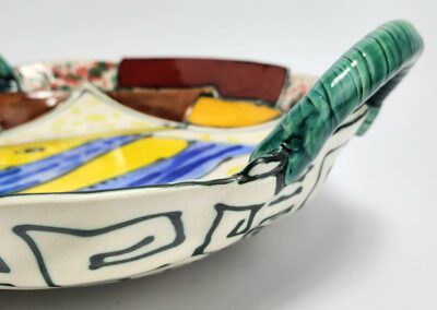 Colorful ceramic dish with abstract design.
