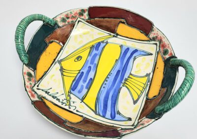 Colorful ceramic plate with fish design.