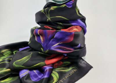 Floral silk scarf on glass mannequin bust.