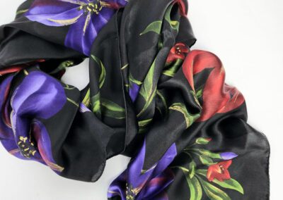 Black floral scarf with colorful flower patterns.