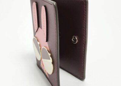 Pink bunny-themed wallet with sunglasses design.