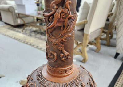 Ornate lamp base with intricate carved designs.