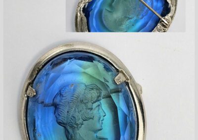 Blue cameo brooch with silver frame.