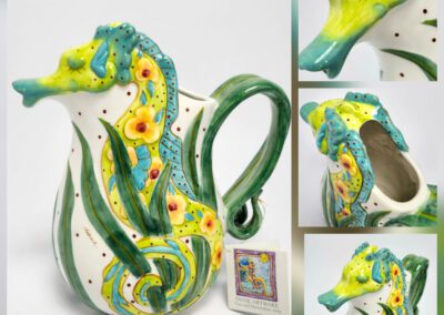 Ceramic pitcher with colorful seahorse design.